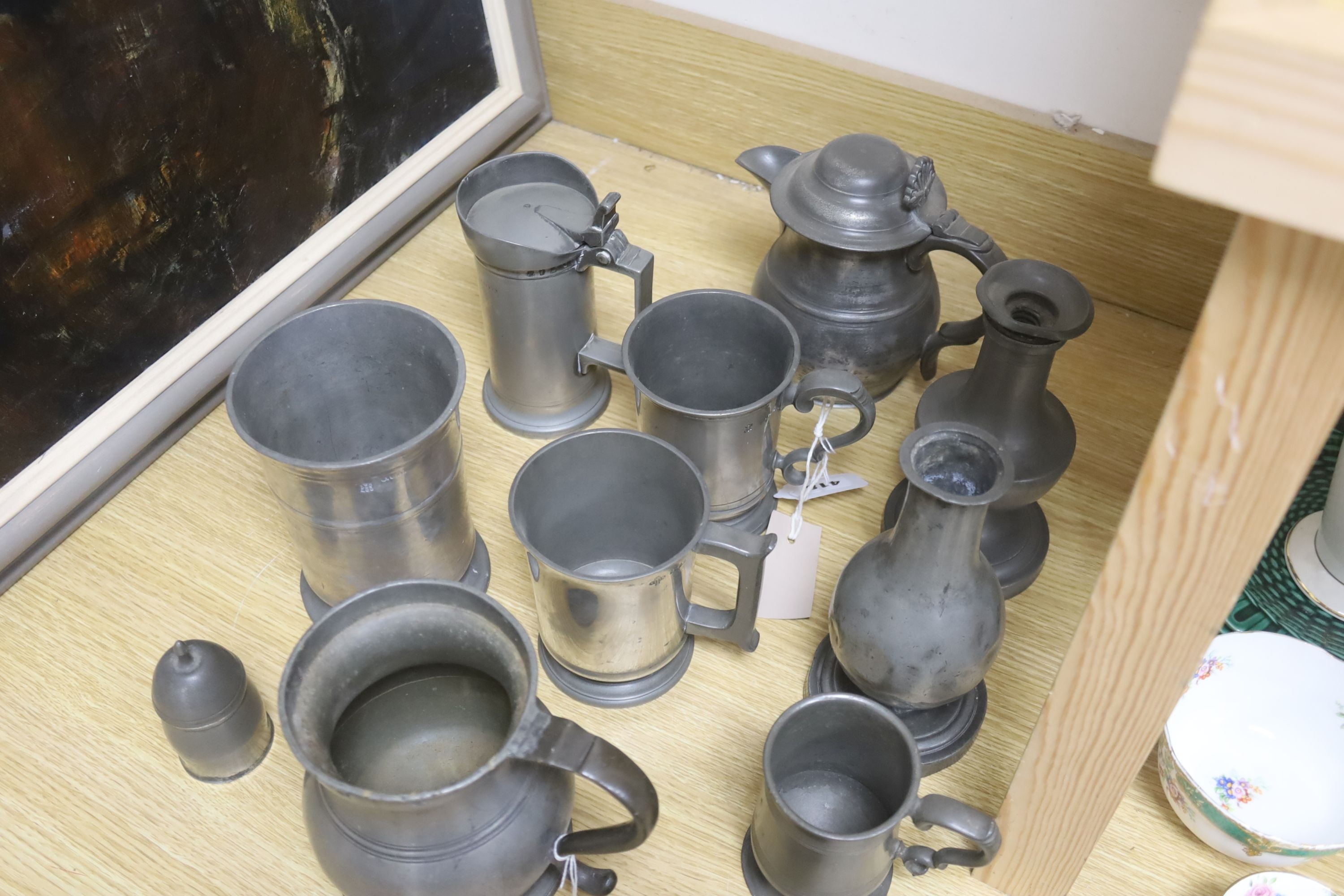 A group of 19th century French and British pewter mugs, measures and other vessels etc.